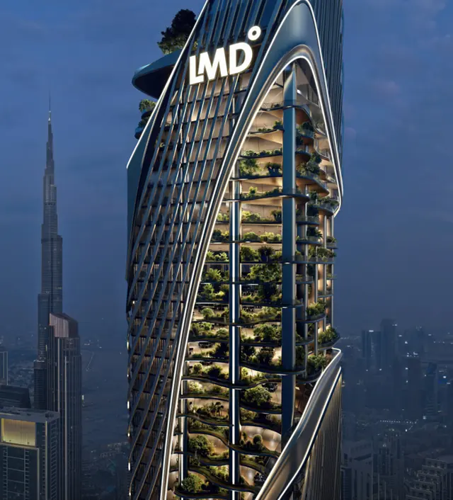 Tower at night beside Burj Khalifa